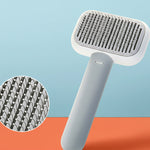 Self-cleaning pet grooming brush for cats and dogs that removes loose fur and reduces shedding.